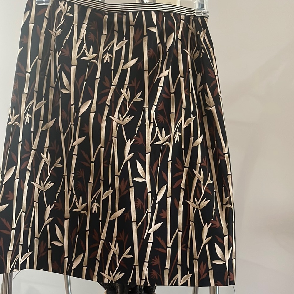 10 Petite cotton skirt in black with brown and tan designs.